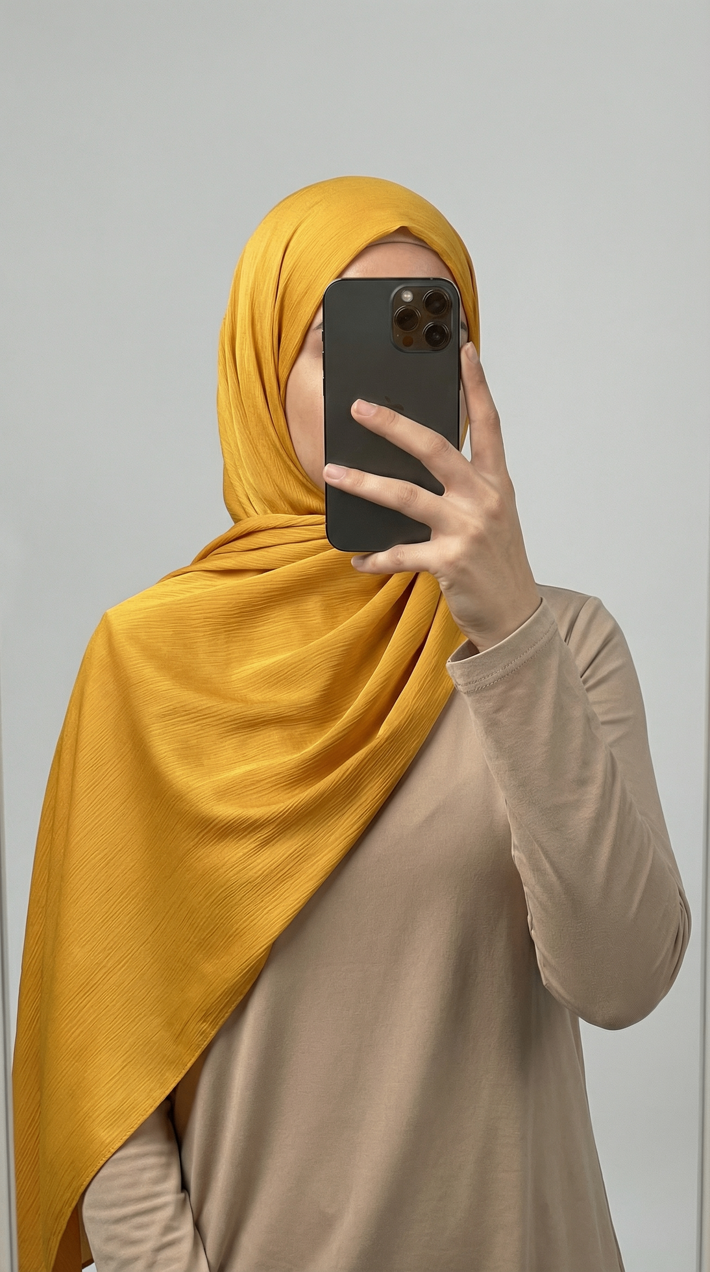 Crinkle textured satin hijab in elegant colors, featuring a soft, lightweight fabric with a stylish textured finish for graceful draping and comfortable wear.