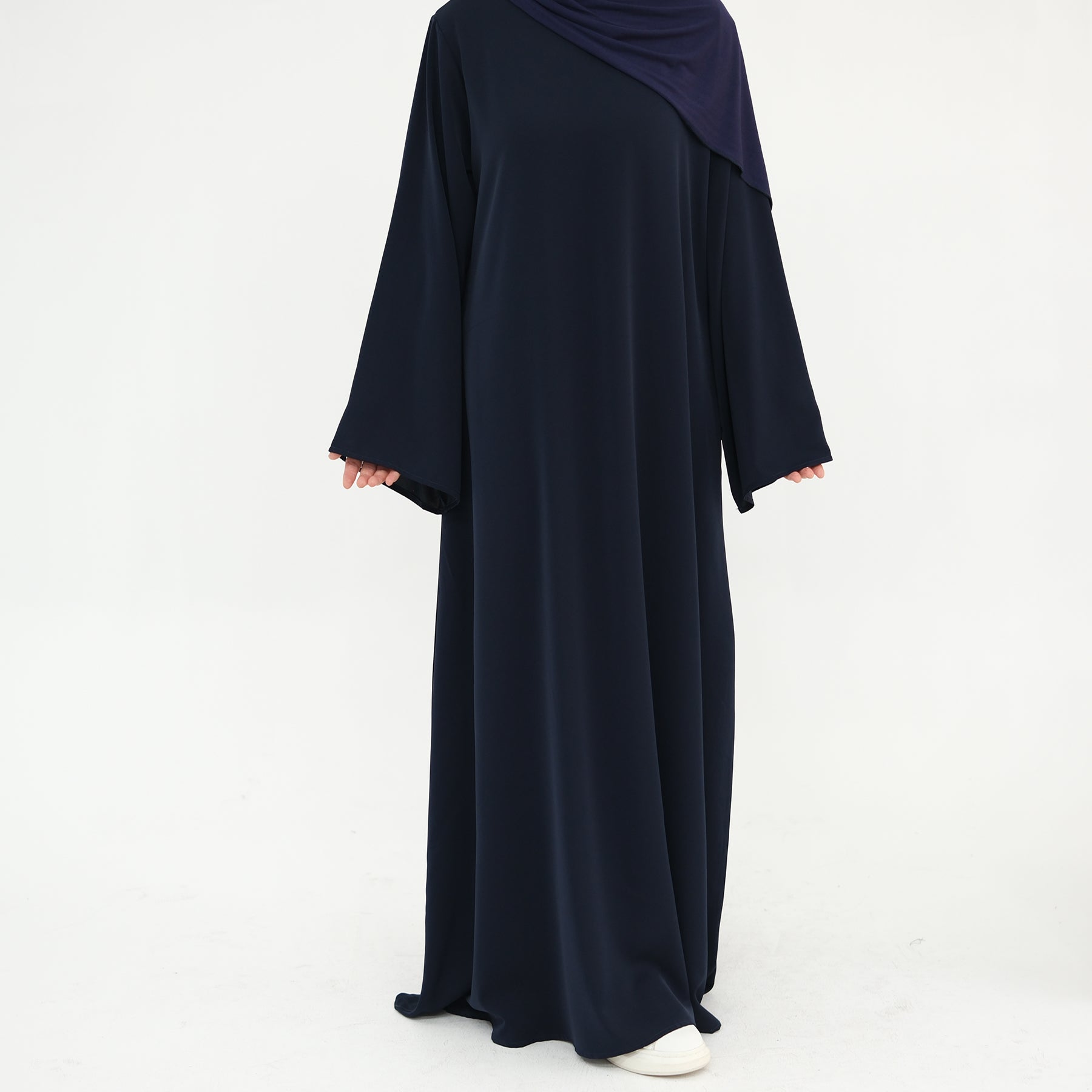 Navy abaya with a matching hijab on a white background