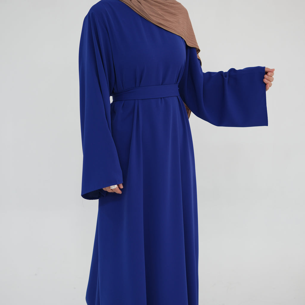 Blue dress with long sleeves on a white background