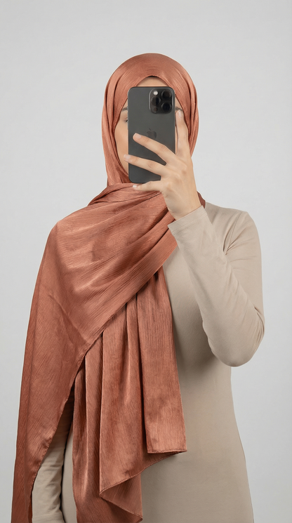 Crinkle textured satin hijab in elegant colors, featuring a soft, lightweight fabric with a stylish textured finish for graceful draping and comfortable wear.