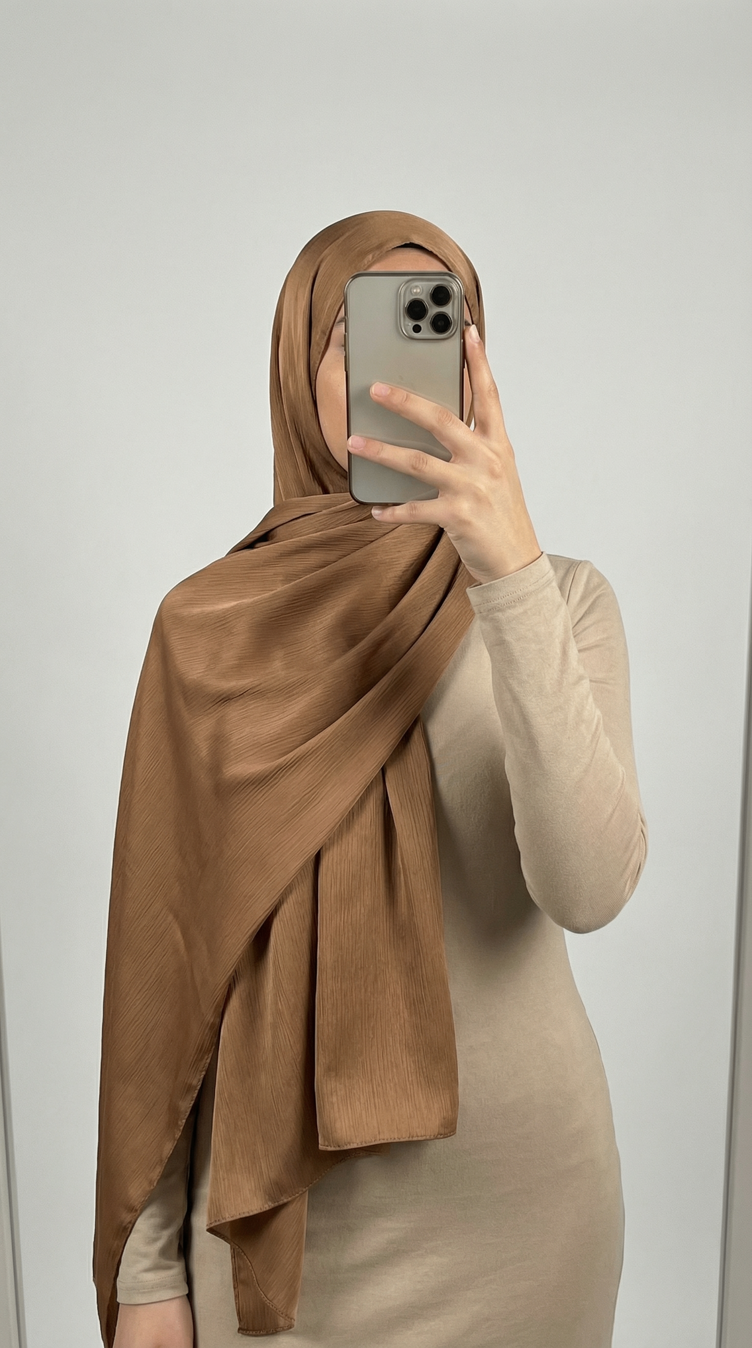 Crinkle textured satin hijab in elegant colors, featuring a soft, lightweight fabric with a stylish textured finish for graceful draping and comfortable wear.