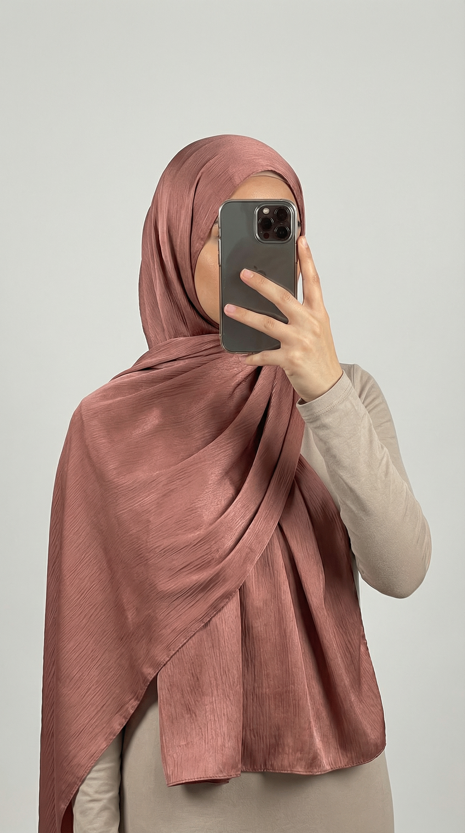 Crinkle textured satin hijab in elegant colors, featuring a soft, lightweight fabric with a stylish textured finish for graceful draping and comfortable wear.