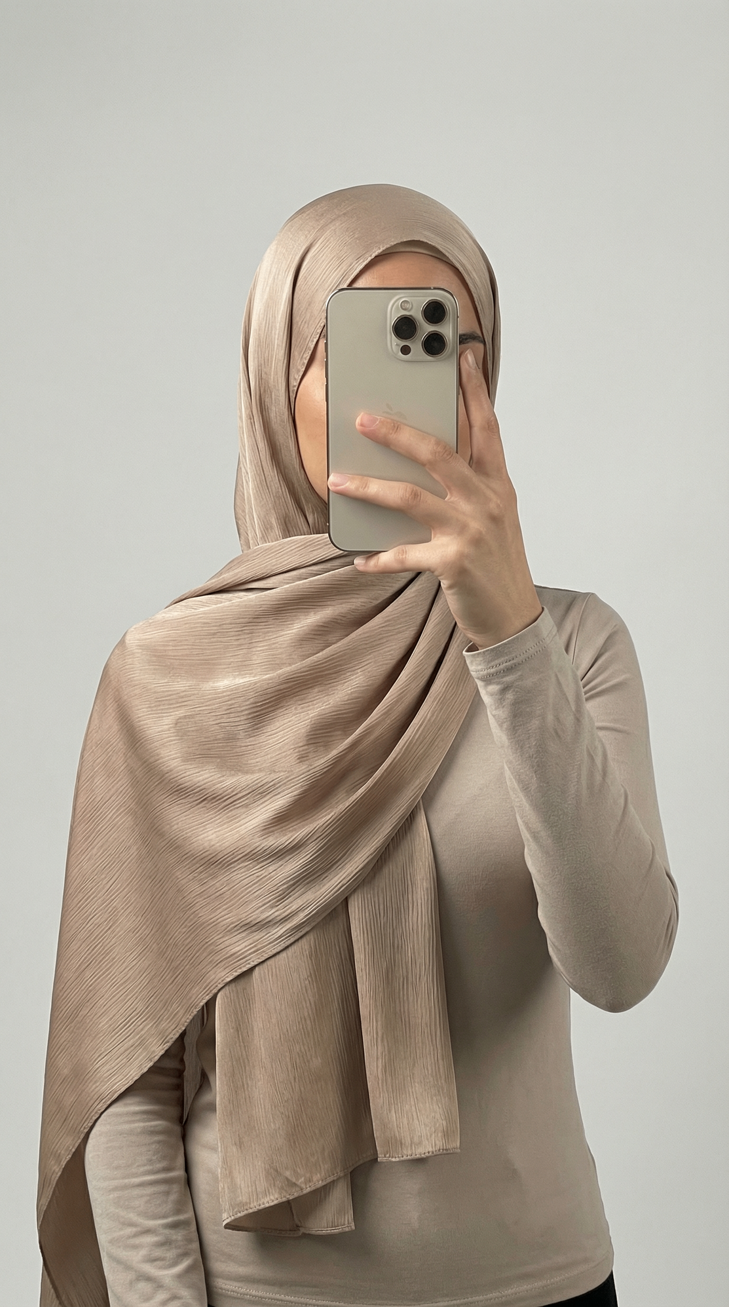 Crinkle textured satin hijab in elegant colors, featuring a soft, lightweight fabric with a stylish textured finish for graceful draping and comfortable wear.