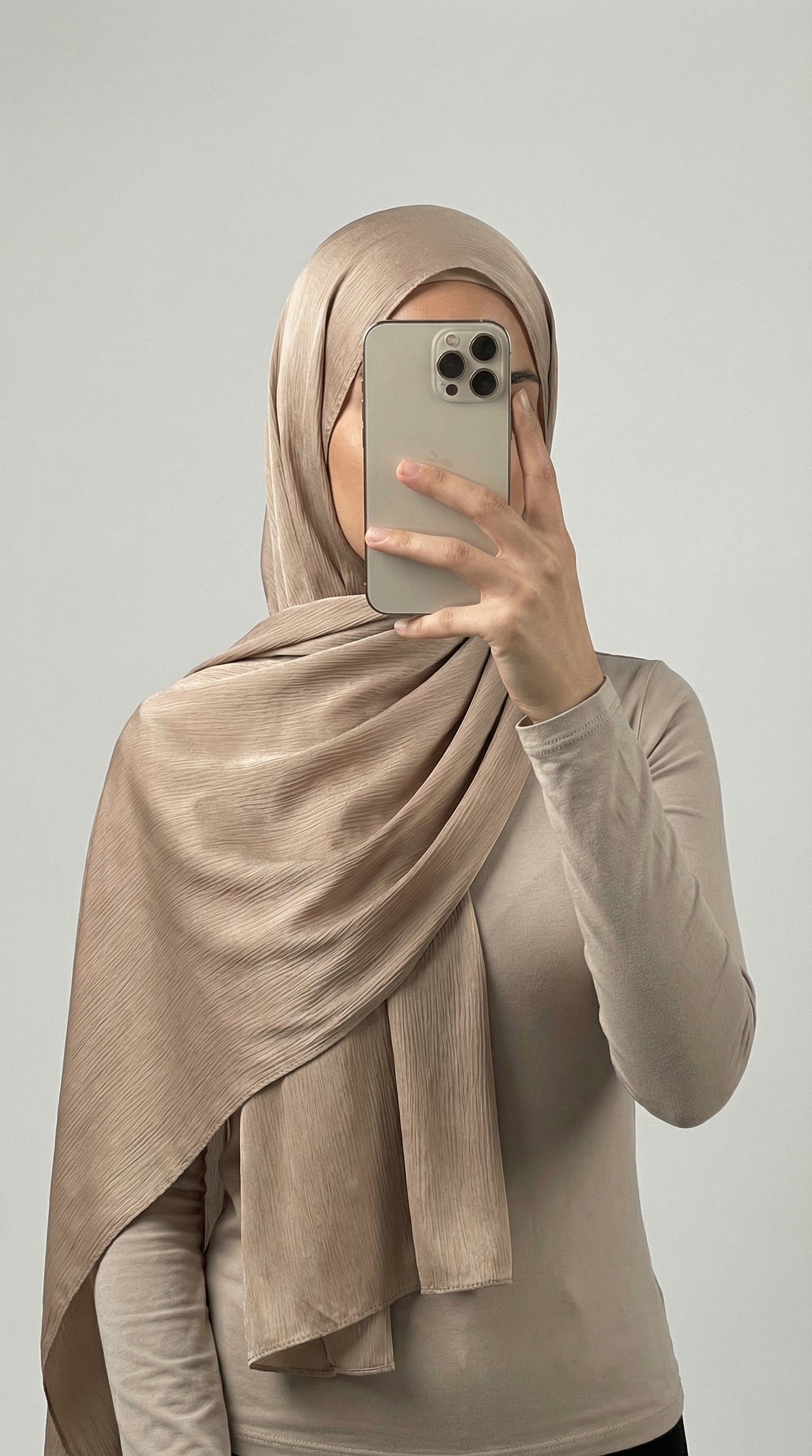 Crinkle textured satin hijab in elegant colors, featuring a soft, lightweight fabric with a stylish textured finish for graceful draping and comfortable wear.