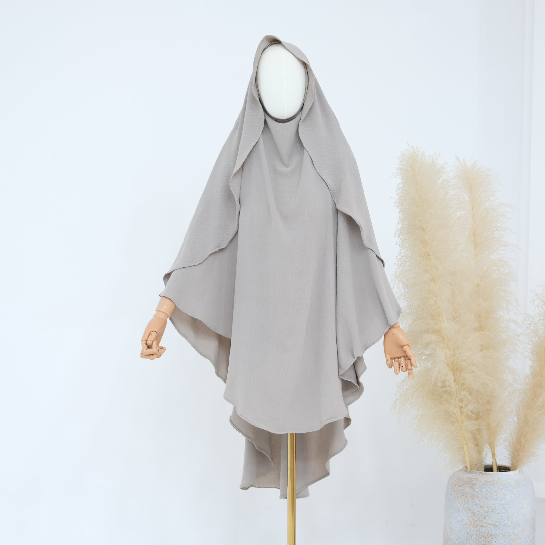 Gray hijab on a mannequin with a white background