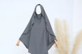 Gray hijab on a mannequin with a white background and pampas grass decor.
