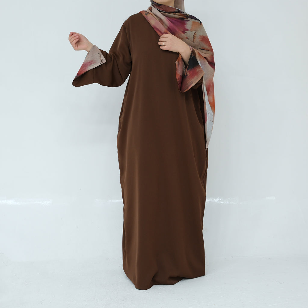 Brown dress with floral hijab on a white background