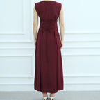 Maroon dress with a tie waist on a white background