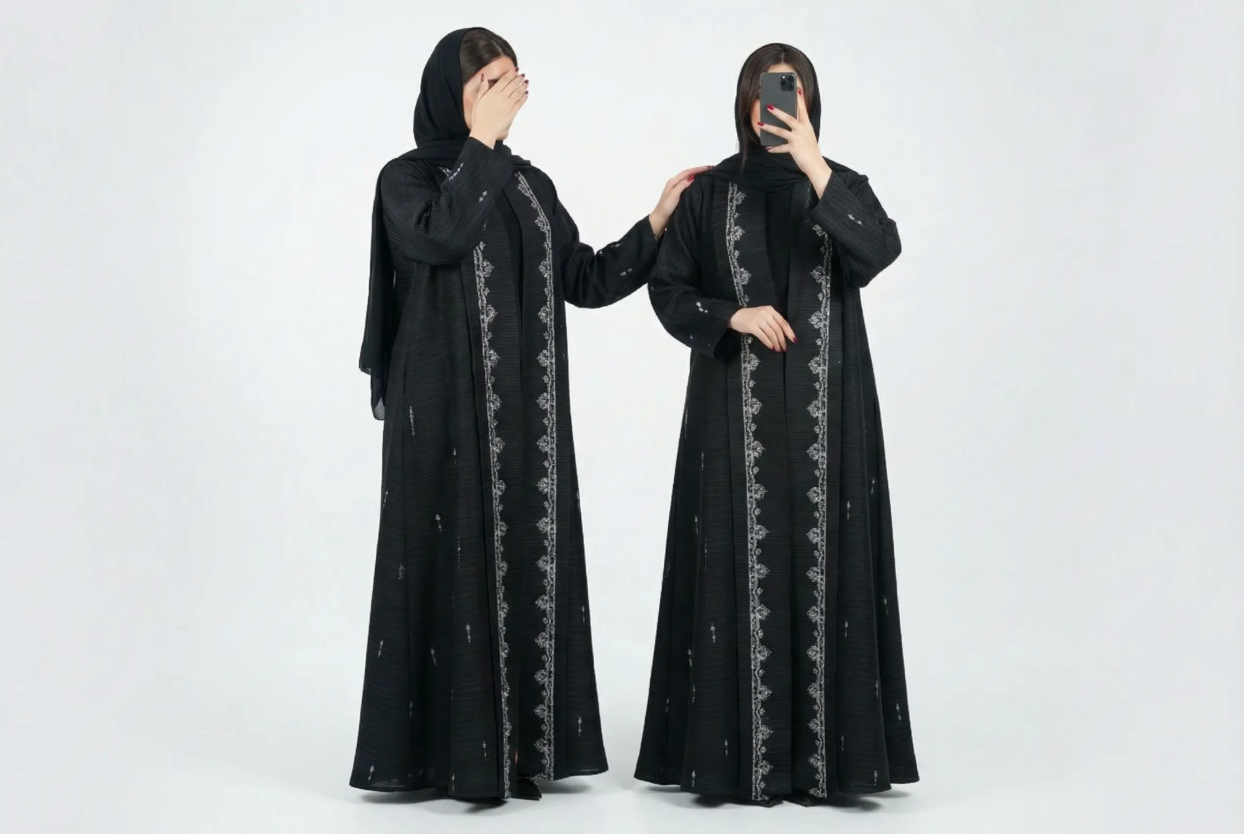 Noor & Grace Abayas and Hijabs - Buy affordable abayas online. Two black abayas with intricate designs worn by a person against a white background