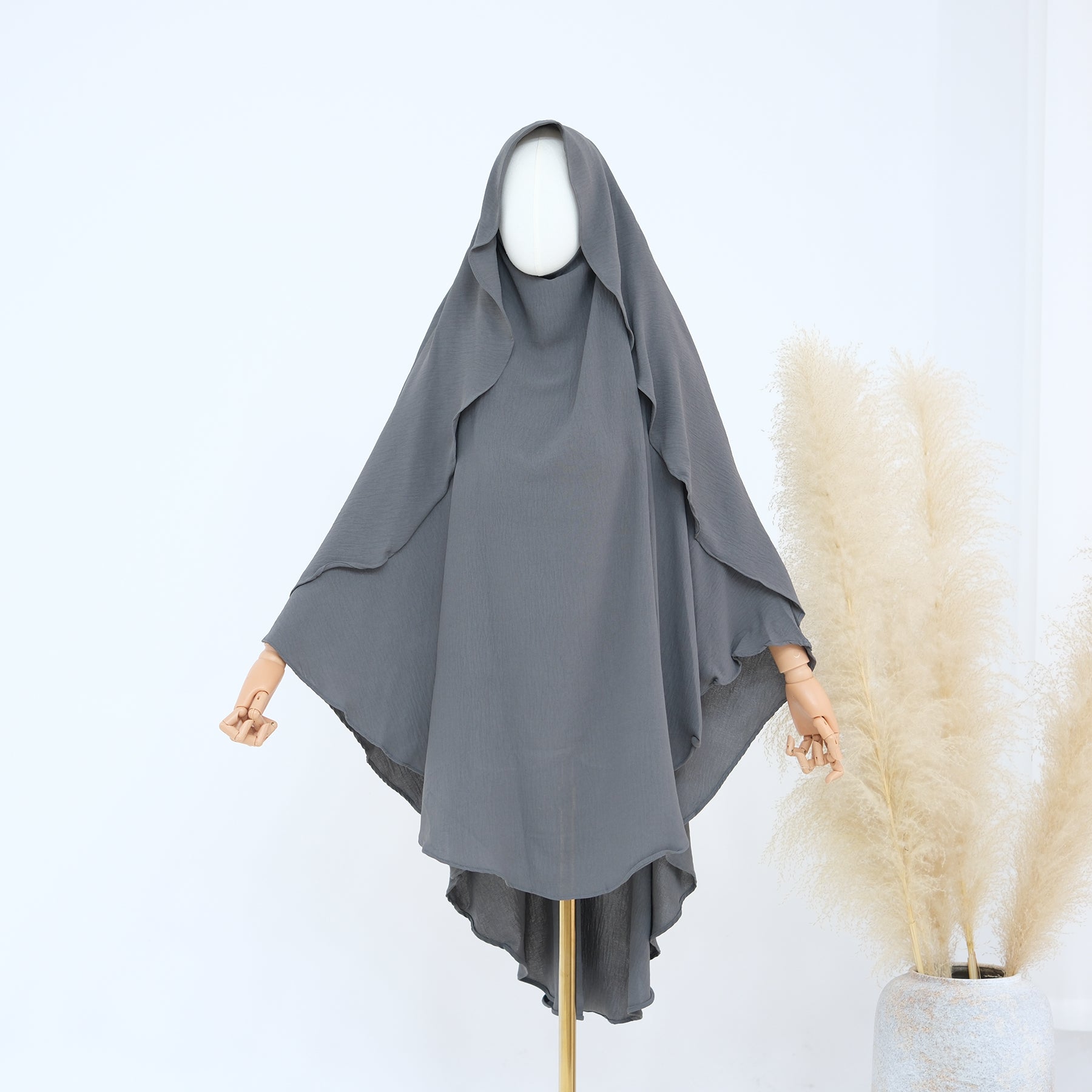 Gray khimar worn by a mannequin on a white background