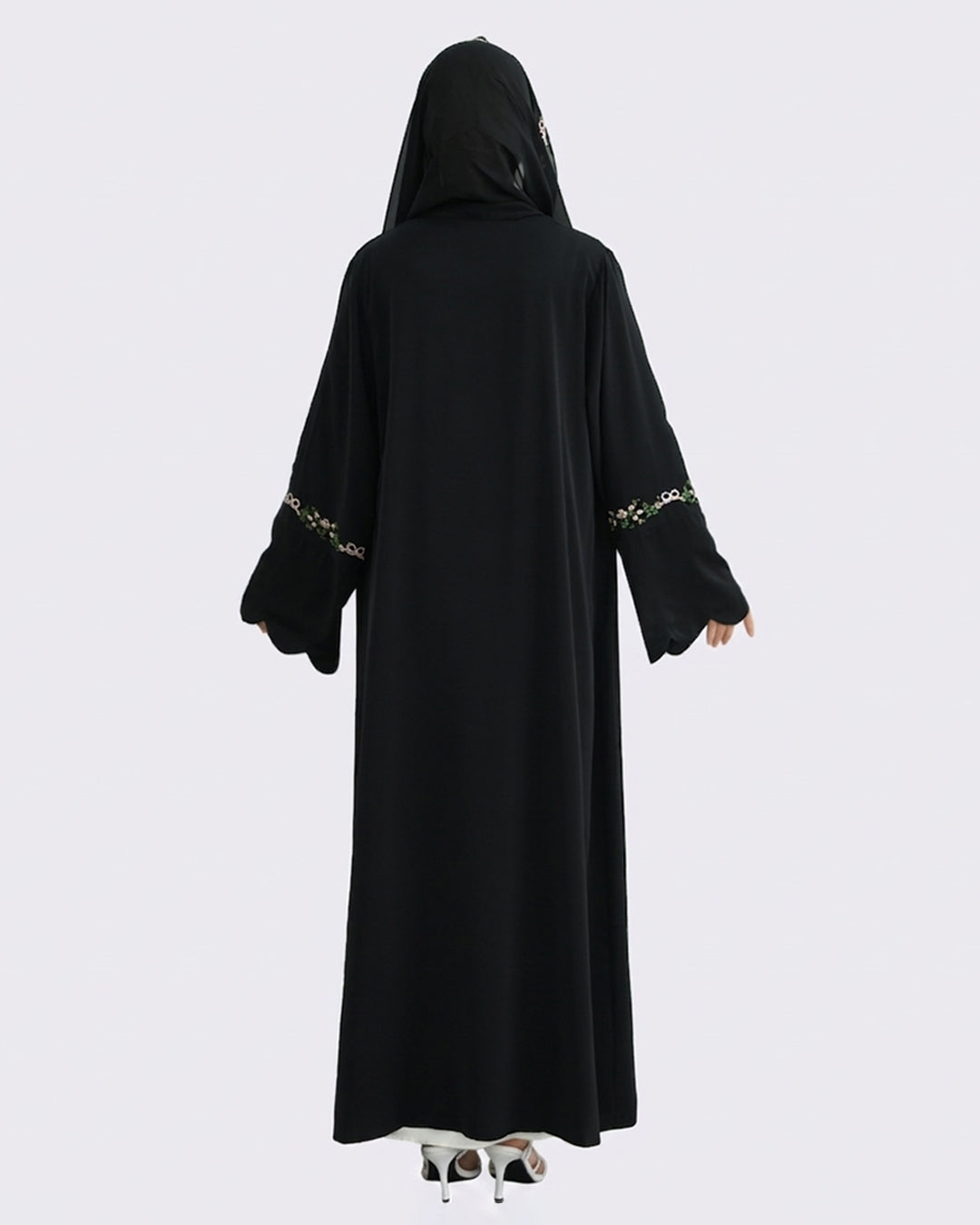 Black abaya with gold embroidery on a white background