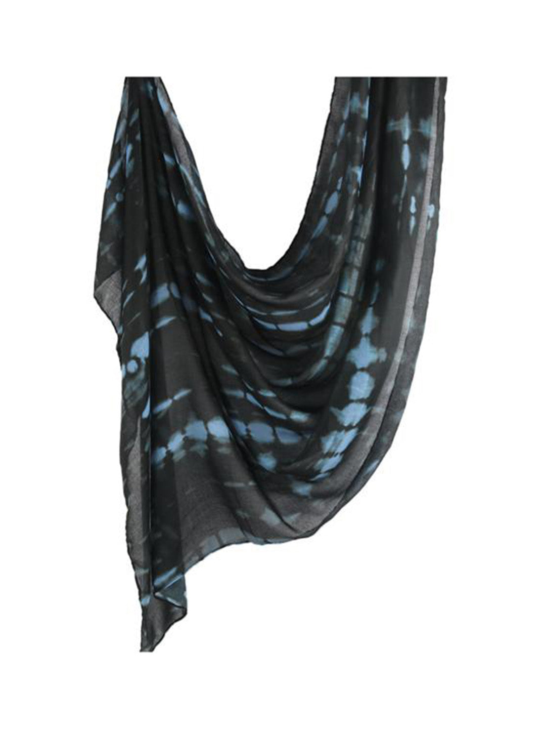 A lightweight black scarf with a blue tie-dye shibori pattern, draped against a solid white background.