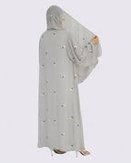 Light gray abaya with pearl embellishments on a white background