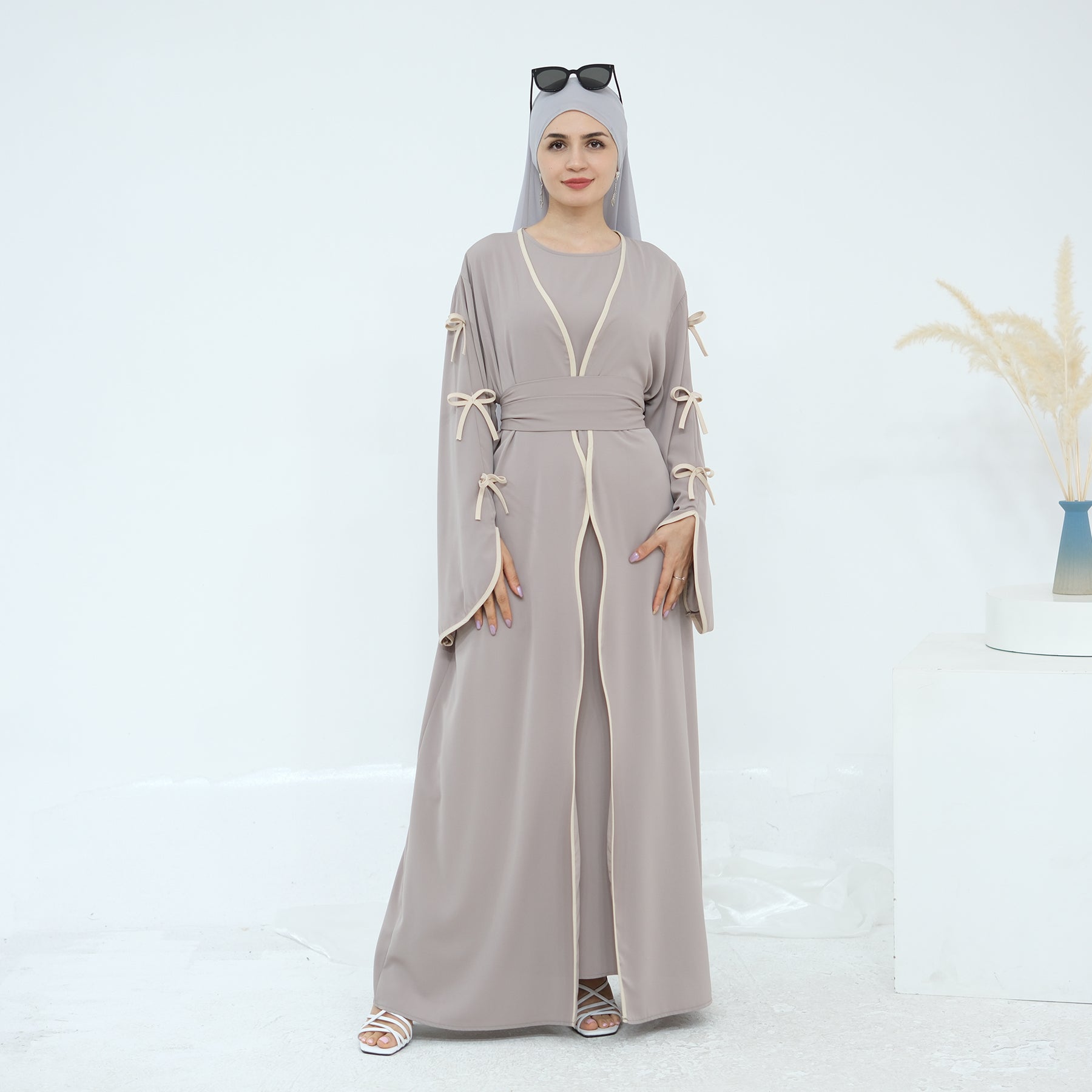 zaynah-flex-nida-bow-abaya-red-taro-noor-and-grace

Alt text