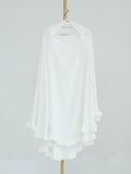 A white long-sleeve blouse with a high-low ruffled hem, displayed on a hanger against a light gray background.